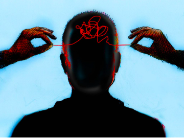 Silhouette of a person's head with tangled red threads representing anxious thoughts being untangled by two hands