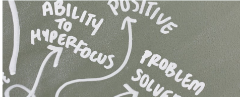 Hand-drawn mind map on gray background showing connections between positive traits like problem solving and ability to