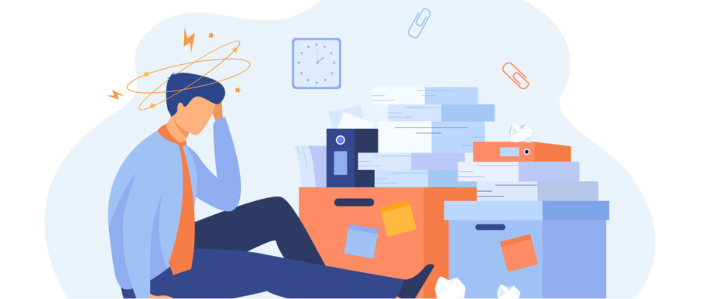 Illustration of a stressed office worker sitting beside piles of paperwork and files, holding their head in distress