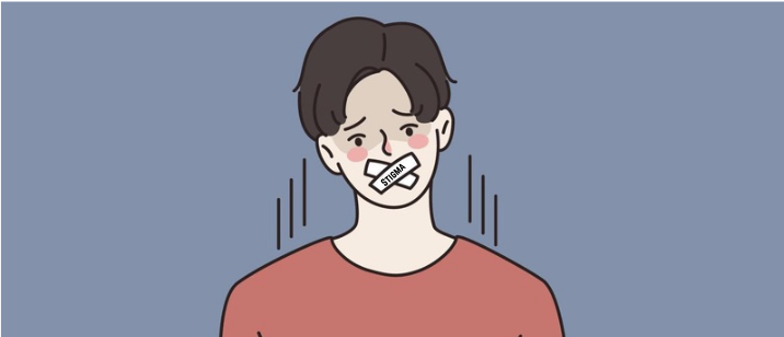 Illustration of a sad man with tape labeled STIGMA over his mouth, symbolizing how stigma silences men from speaking about