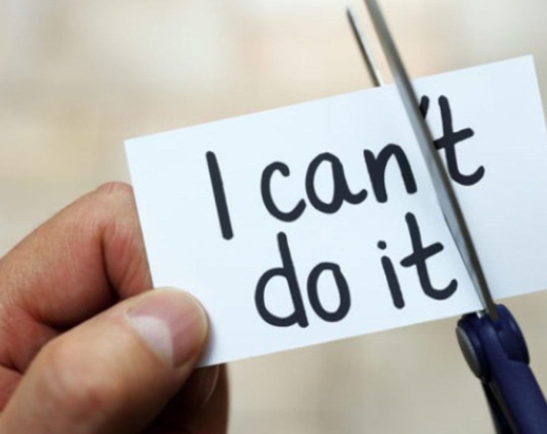 Scissors cutting a paper so the word can't becomes can, with do it written below